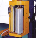 A view of the stretch wrapper showing the film carriage located on the side of machine