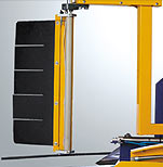 A view of the stretch wrapper showing the film carriage located on the side of machine